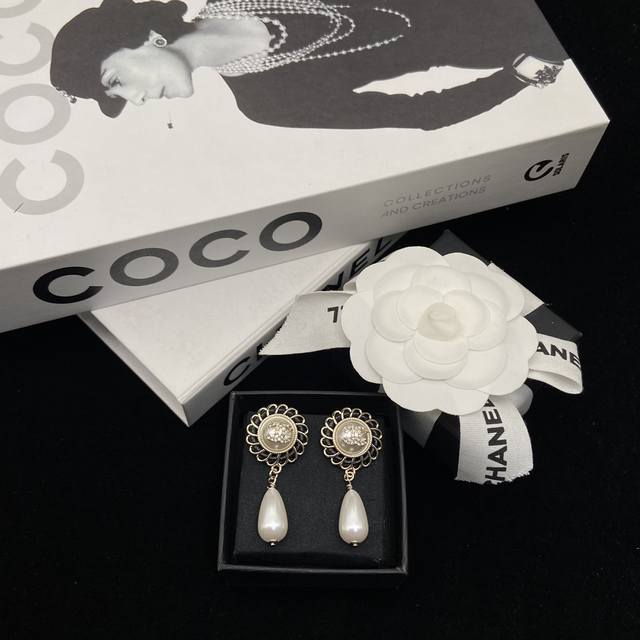 Today's Pick: Chanel's new 24K leather-strapped button teardrop pearl earrings.