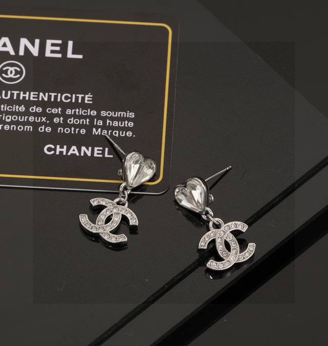 Chanel Heart Peach Earrings - A fashionable and stylish piece from Chanel's earl