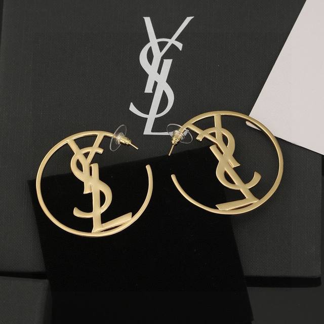 YSL Saint Laurent earrings, original brass material. Yves Saint Laurent, founded