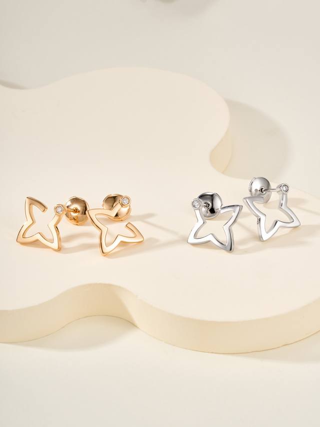 Blossom earrings continue the brand's iconic Monogram four-pointed star design.