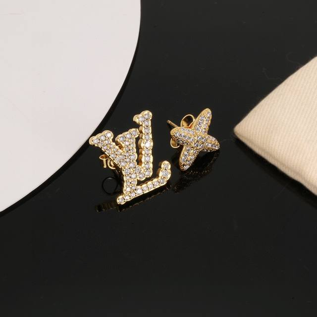 Louis Vuitton gold letter stud earrings bring a fashionable and fun visual appea