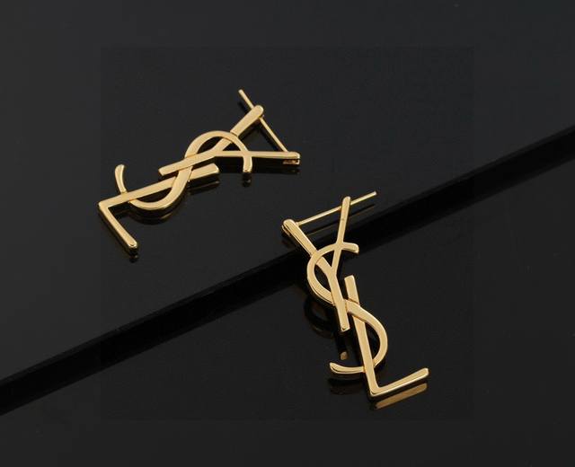 YSL Saint Laurent earrings, made of original brass. Yves Saint Laurent, founded