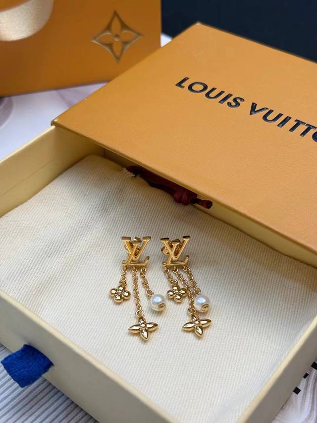 LV Monogram Enamel Earrings. These LV Monogram enamel earrings feature a metal m