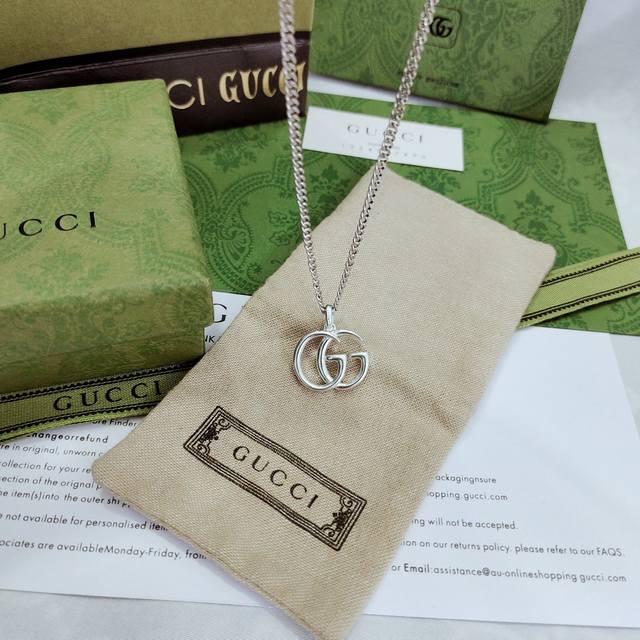 Gucci double G pendant inspired by the logo's glorious 70s vintage design, paire