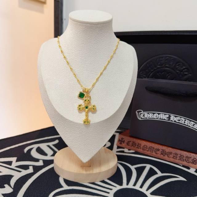 New boutique quality Chrome Hearts green diamond flame cross necklace. The embos