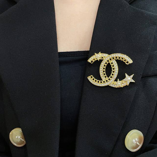 Chanel's newest brooches are now available at boutiques. Chanel brooches are the