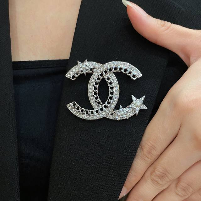 Chanel's newest brooches are now available at boutiques. Chanel brooches are the