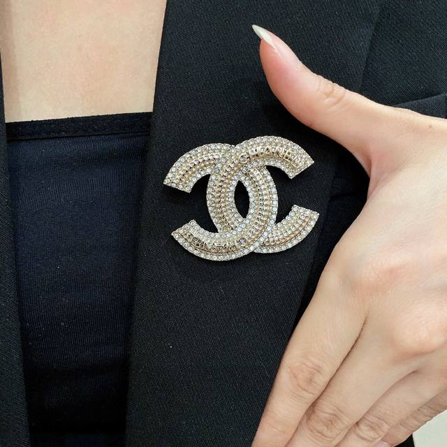 Chanel's newest brooches are now available at boutiques. Chanel brooches are the