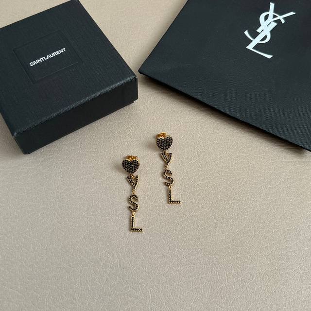 Saint Laurent earrings with a superb metallic texture, made of original brass, e