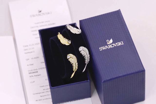 Swarovski Gold and Silver Feather Open Bracelet (Ddd) Feathers are currently a h