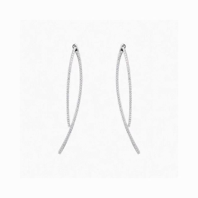 Apm Monaco Hyperbola Earrings! Featuring a hyperbola S-curve design, this simple