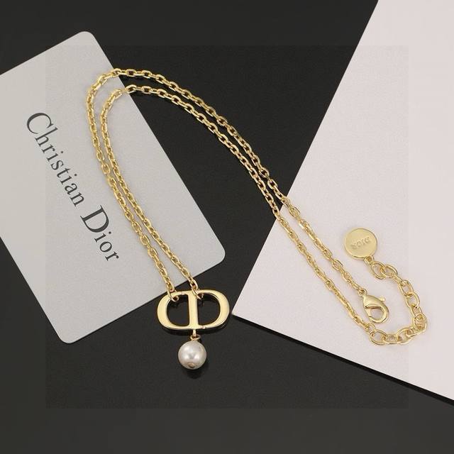 Dior CD necklace. The simple CD design is undeniably stylish. The elegant pearl