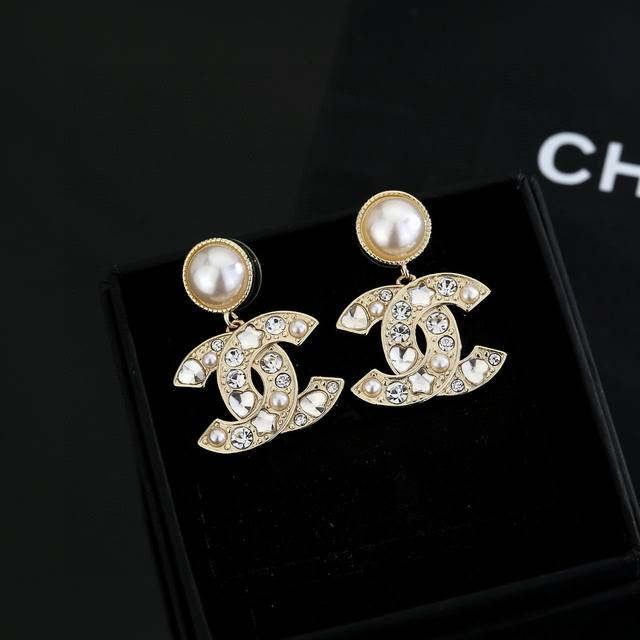 Chanel light gold earrings are a trendy early spring style. Whether you have a r