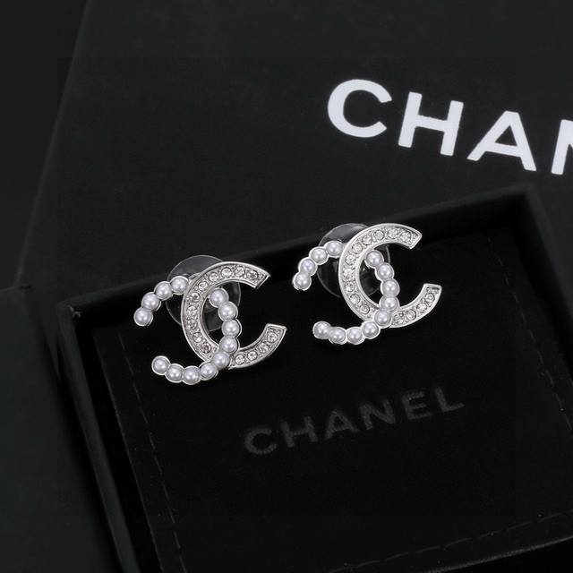 Chanel earrings are right on trend for early spring. Whether you have a round or