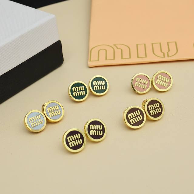 Miumiu Candy Color Enamel Button Earrings. Featuring Miumiu's logo design elemen