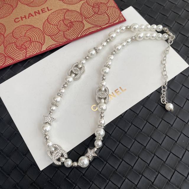 Chanel 25S Five-Pointed Star Pearl Double C Choker Necklace. A basic, delicate,