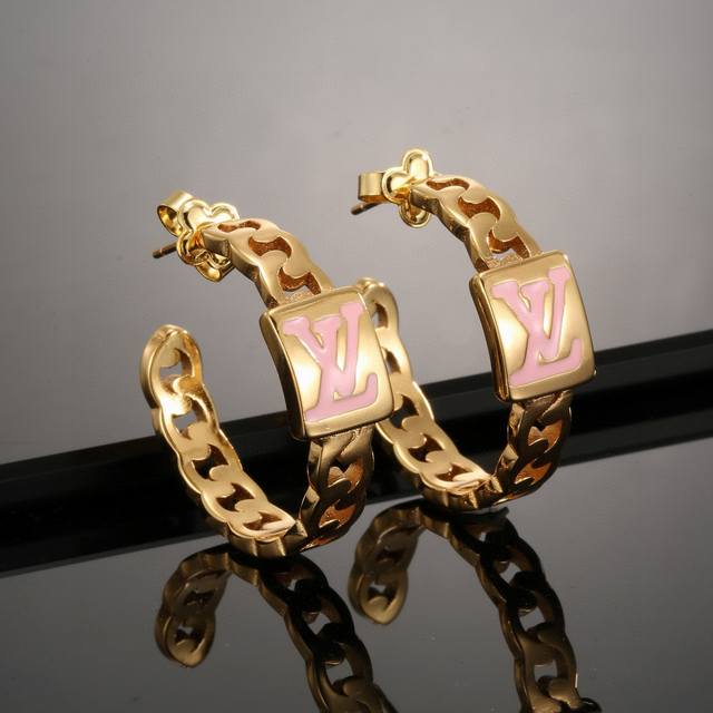 Louis Vuitton gold letter stud earrings bring a fashionable and fun visual appea