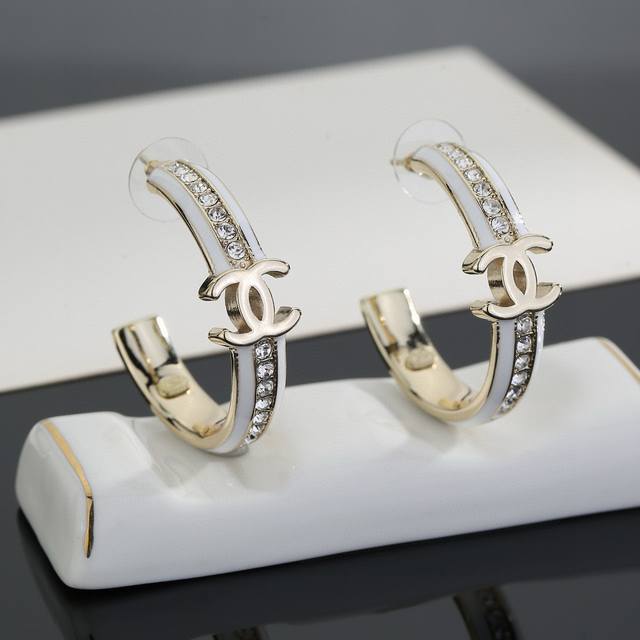 Chanel light gold earrings are a trendy early spring style. Whether you have a r