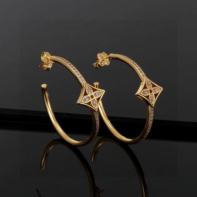 These exquisitely crafted Louis Vuitton earrings embody superb craftsmanship, us