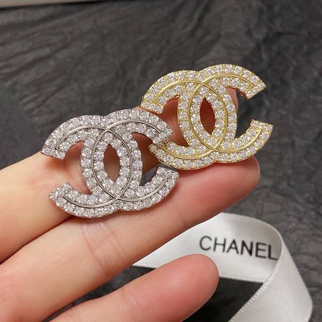 Chanel's newest brooches are now available at boutiques. Chanel brooches are the