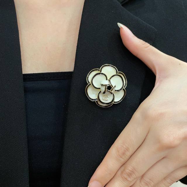 Chanel's newest brooches are now available at boutiques. Chanel brooches are the