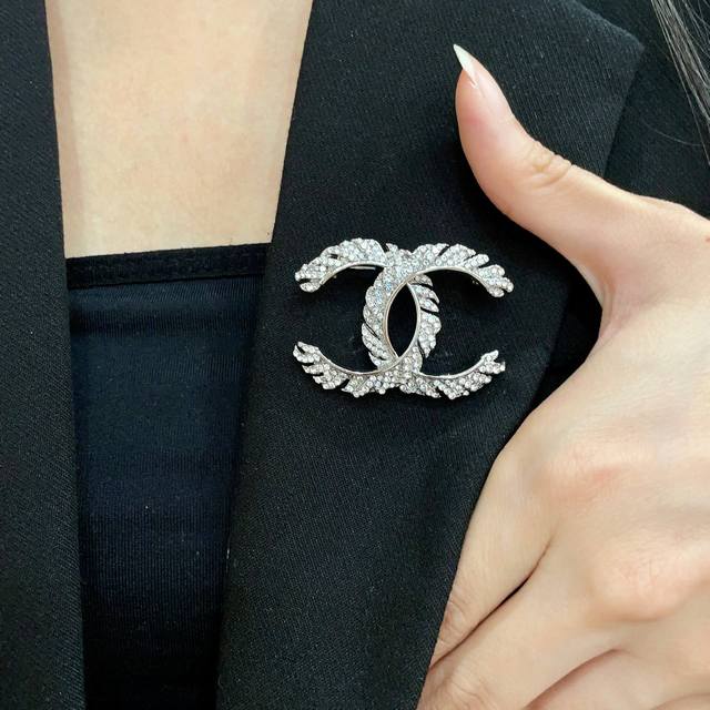 Chanel's newest brooches are now available at boutiques. Chanel brooches are the