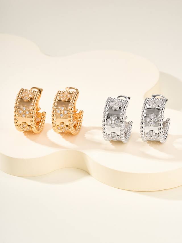 The upturned bead design has a lively texture, paired with a rhinestone four-lea