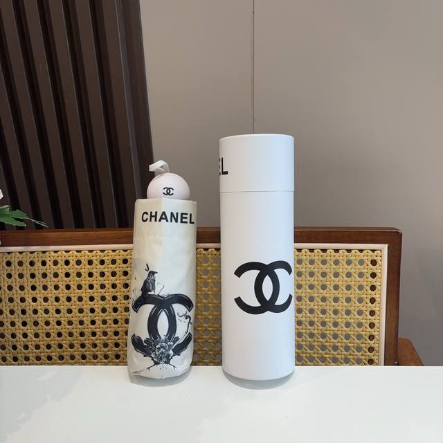Chanel 50% folding umbrella with a unique design incorporating the iconic Chanel