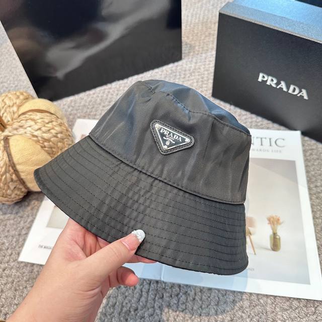 Prada's classic triangle logo bucket hat, makes your face look smaller, a high-e