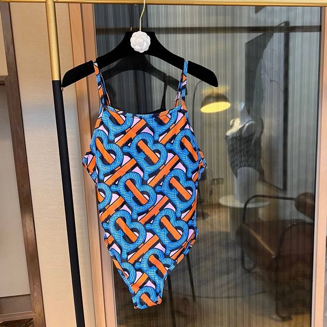 Special Offer: Burberry Tb letter onesie swimsuit, available at major boutiques.
