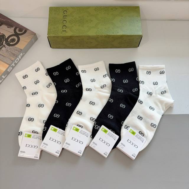 A box of 5 pairs of Gucci mid-calf socks for men and women, a super popular item