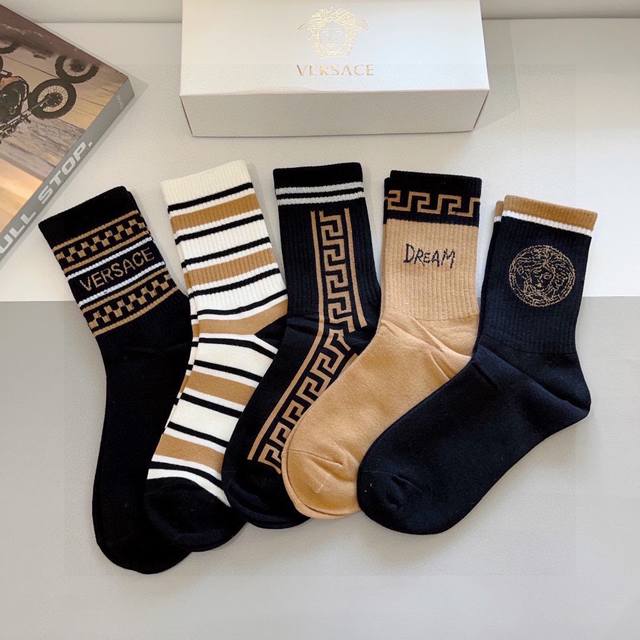 A box of five pairs of Versace brand cotton knee-high socks, including packaging