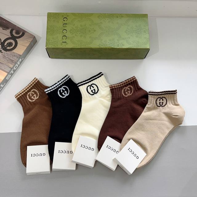 A box of 5 pairs of Gucci short socks, a super popular item on Instagram, made o