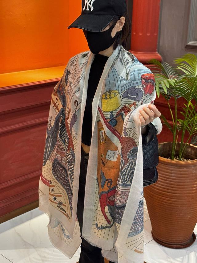 A glowing, shiny Hermes scarf, purchased directly from the Hermes boutique and h
