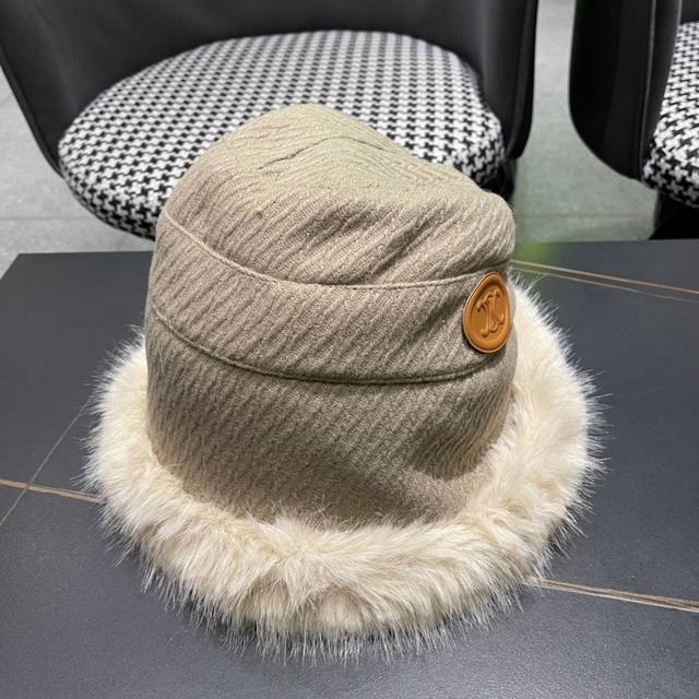 Celine's new Fall/Winter collection features a warm, irregularly styled bucket h