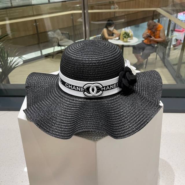 Chanel's new straw camellia woven bucket hat, a must-have for vacations and leis