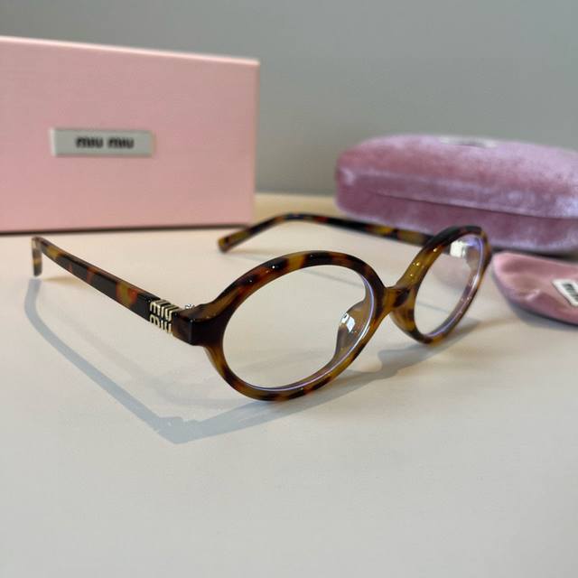 Styling Essential: Miu Miu's New Retro Small Oval Frame Sunglasses. A fashionabl