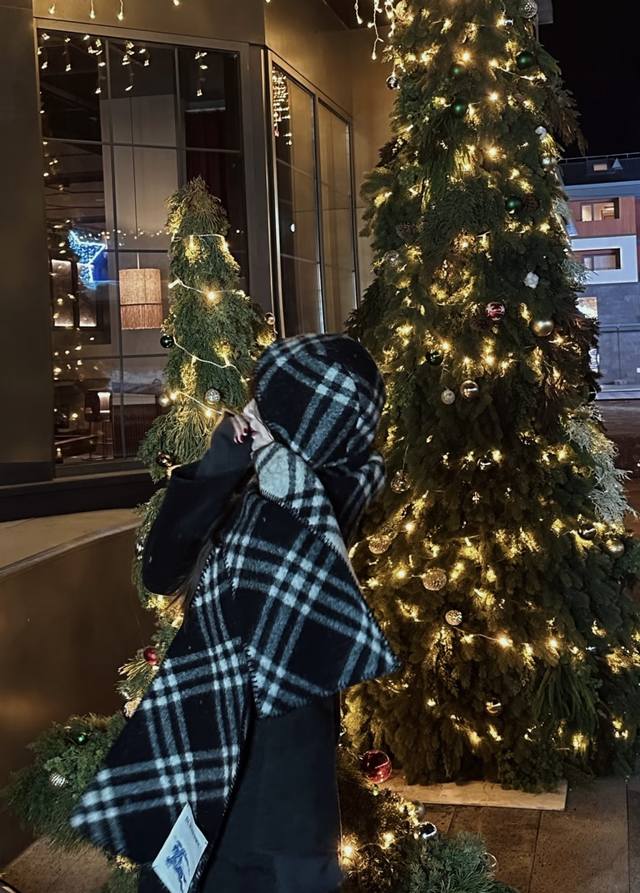 The latest Burberry signature hooded cape, a two-in-one scarf and shawl, is a mu