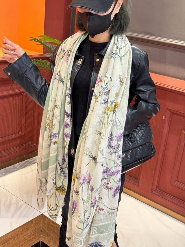 A glowing, shiny scarf from D brand, featuring the Sun Goddess silver silk. A VI