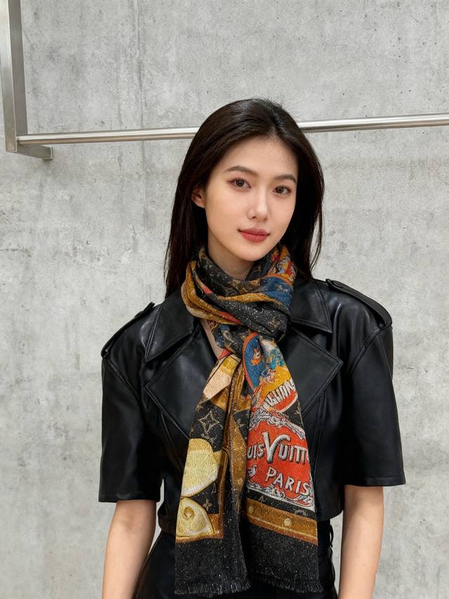 This glowing scarf is truly amazing! A long, silver-threaded cashmere scarf with