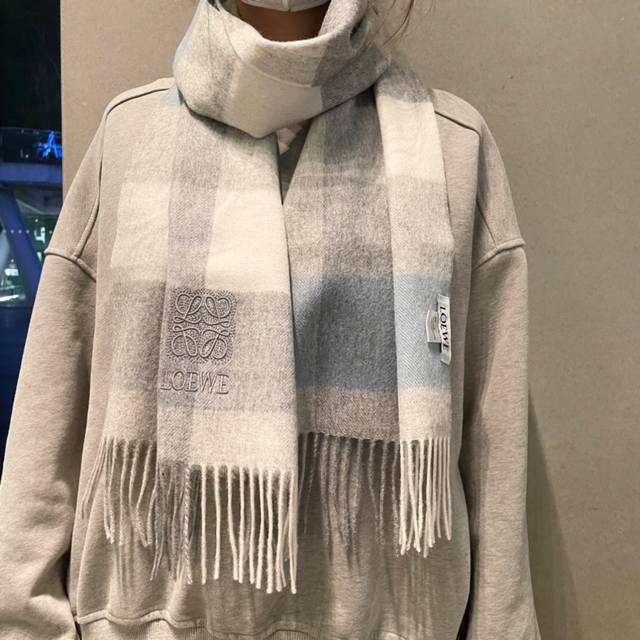 A rare high-end family perk: a Loewe scarf with exquisite embroidery! I love the