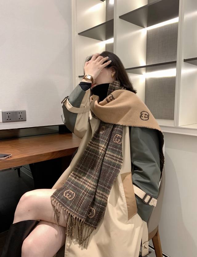 Latest reversible scarf. The Gg logo, a quintessential element of Gucci's herita