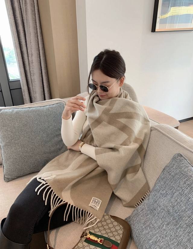 Toteme wool scarf, a Nordic trendy brand, features double-sided jacquard weave.