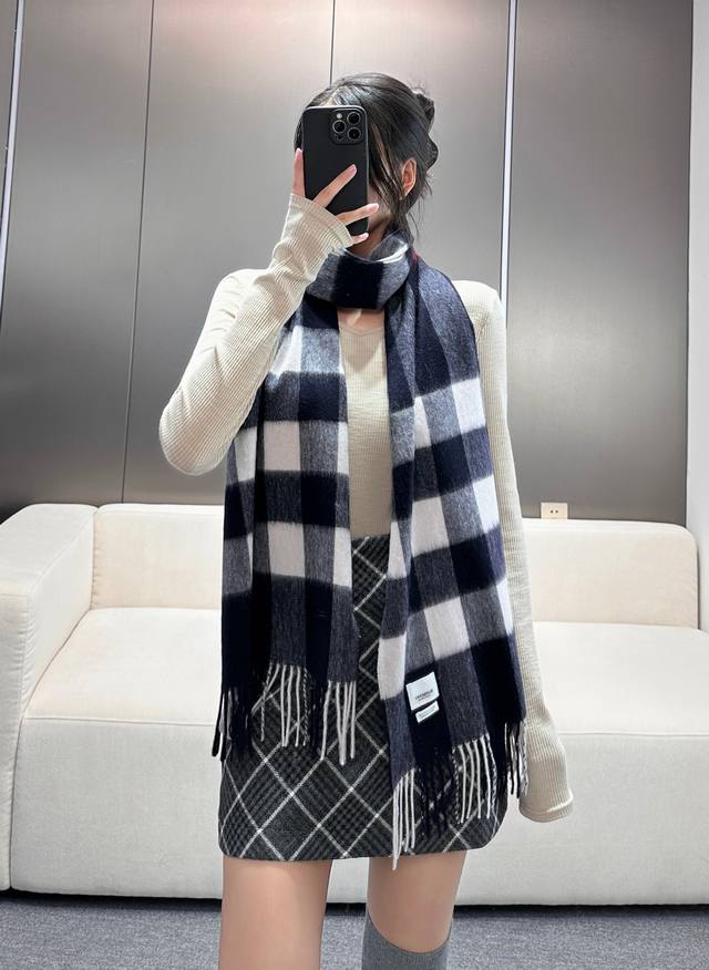 Burberry's classic cashmere check scarf, a top-rated item, is now available in p