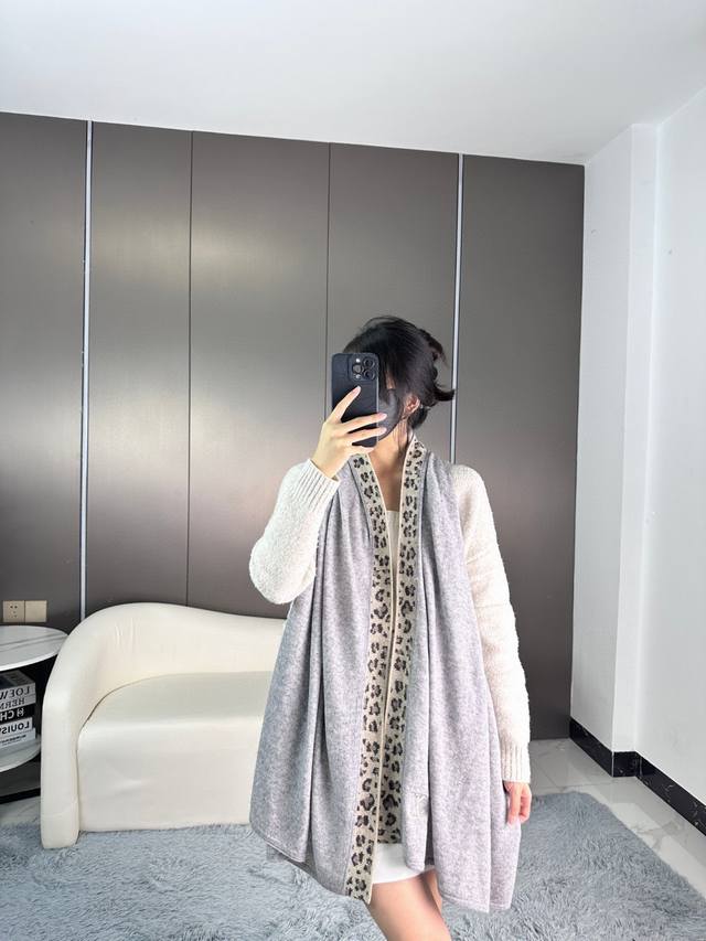 Louis Vuitton's highly anticipated leopard print cashmere knit shawl, a must-hav