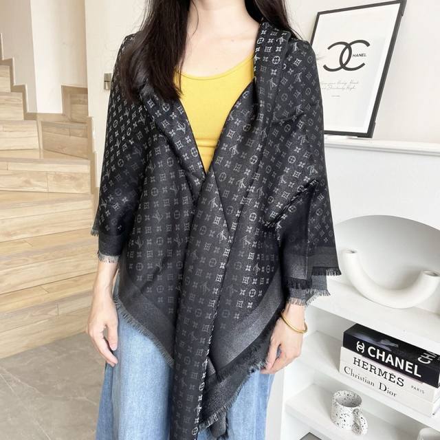 This Louis Vuitton square scarf/shawl features classic gold thread paired with a