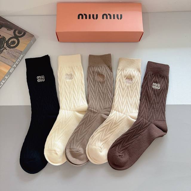 A box of 5 pairs of Miu Miu high-quality embroidered cashmere knee-high socks, a