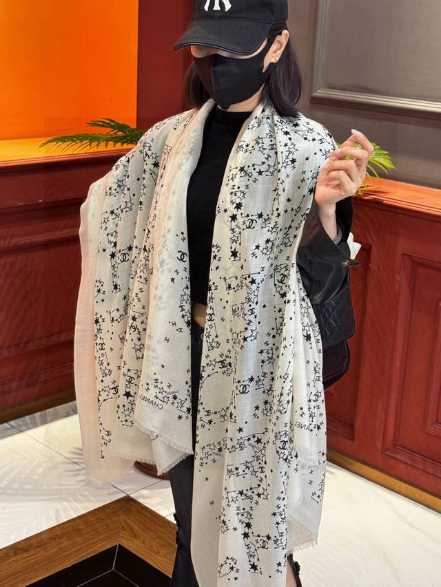 Chanel's classic design is elegant and sophisticated. A perfect scarf to wear ar