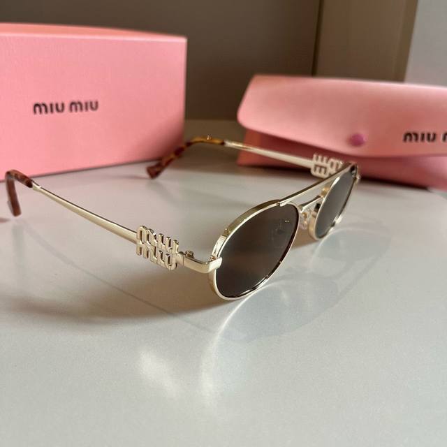 A super cool and exquisite pair of Miumiu small-framed sunglasses. Wearing them