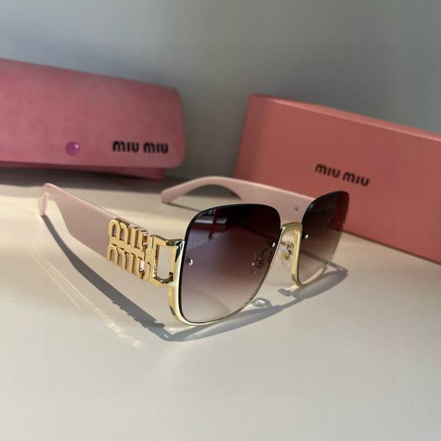 Miu Miu Sunglasses Black with gold logo is always the perfect combination. A mus